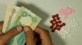 Emirati Dirham AED, Counting Drugs and Money, Health Care, Colorful Pills HD Footage