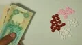 Emirati Dirham AED, Counting Drugs and Money, Health Care, Colorful Pills HD Footage