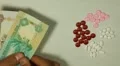 Emirati Dirham AED, Counting Drugs and Money, Health Care, Colorful Pills HD Footage