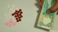 Emirati Dirham AED, Counting Drugs and Money, Health Care, Colorful Pills HD Footage