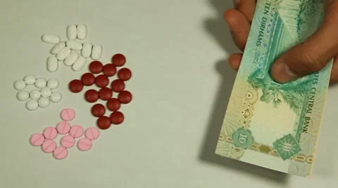 Emirati Dirham AED, Counting Drugs and Money, Health Care, Colorful Pills Stock Footage