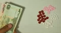 Emirati Dirham AED, Counting Drugs and Money, Health Care, Colorful Pills HD Footage