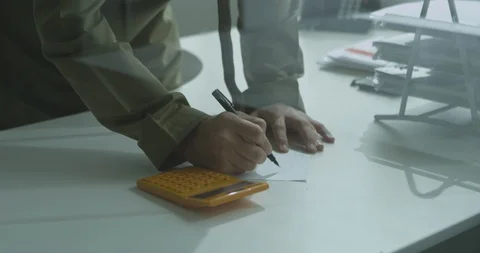 An Emirati man making notes in a meeting room. Stock Footage 90899450