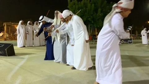 Emirati men dancing and celebrating a national day Stock Footage 120198355