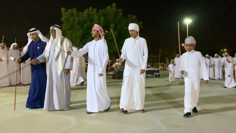 Emirati men dancing to celebrate a Natinoal Day Stock Footage