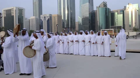 Emirati Men performing Al Ayala traditional dance in Downtown Stock Footage 136835390