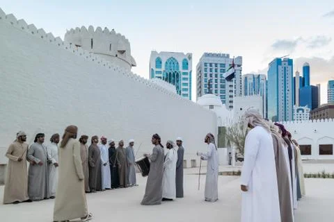 Emirati Middle Eastern Men performing a traditional dance (The Yowla) Stock Photos