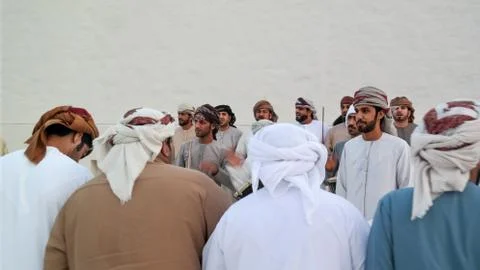 Emirati (Middle Eastern) Men performing a traditional dance - The Yowla Stock Photos