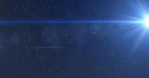 Emitting bright blue star sending radial beams across outer space, lens Stock Photos