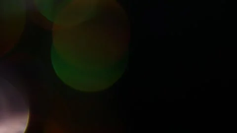 Emitting white and other colored light on the left side of the frame Video stock 309969099