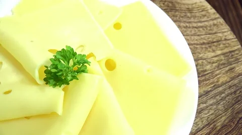 Emmental Cheese Slices (loopable) Stock Footage 47172796