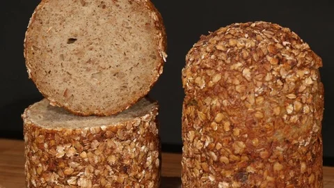 Emmer amelcorn wheat bread on turntable Stock Footage 84216137