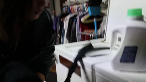 Emo teen doing laundry Stock Footage 79049521