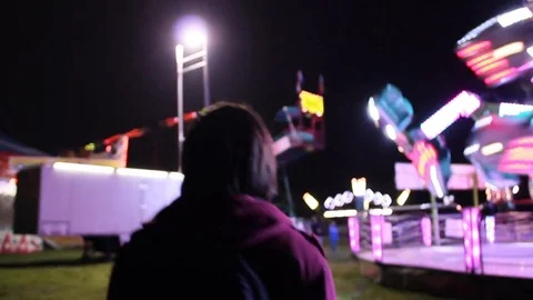 Emo teen walks through fair Stock Footage 80273455