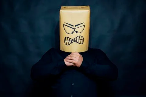 Emotion concept. The man is looking forward. Hands are fastened on the chest Stock Photos