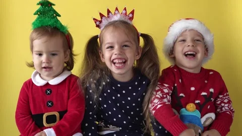 Emotion Cute Happy Cheerful 3 Siblings Friends Baby Girl And Boy in Santa Suit Stock Footage 163845719