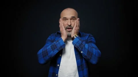 Emotion, expression and people concept - shocked man over black background Stock Footage 147334472