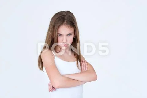 Emotion hurt look offended kid girl crossed arms Stock Photos