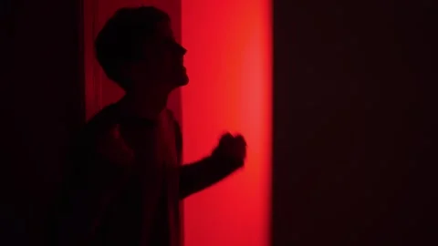 Emotional aftermath of a relationship argument as a man talks to himself in a Stock Footage 325185029