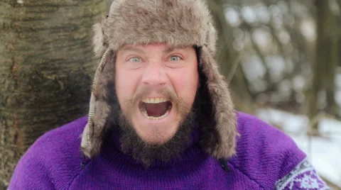 Emotional bearded man looking into the camera, swearing, smoking, laughing. Stock Footage 59658953