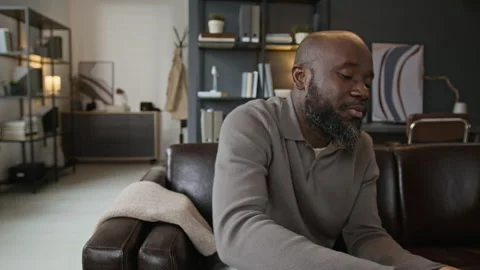 Emotional Black Man Sharing Problems during Therapy Session Stock Footage 337636522