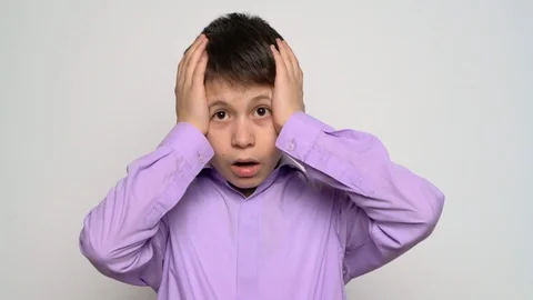 Emotional boy posing on white background Stock Footage 106884052