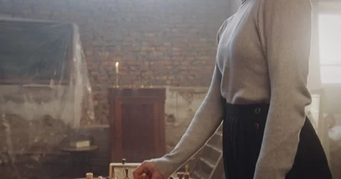 Emotional Breakup Symbolized by Chess Move as Woman Leaves Wedding Ring on Queen Видео 299549844