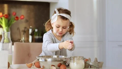 Emotional child cooking cake Easter Christmas party kitchen. Home bakery Stock Footage 161971656