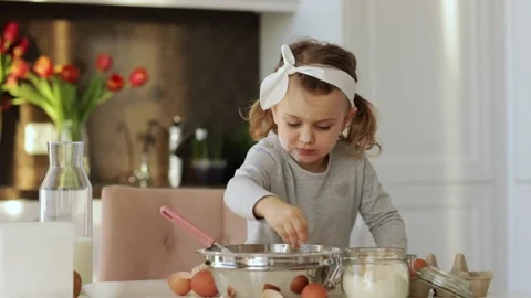 Emotional child cooking cake Easter Christmas party kitchen. Home bakery Stock Footage 161971658