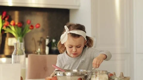 Emotional child cooking cake Easter Christmas party kitchen. Home bakery Stock Footage 161971659