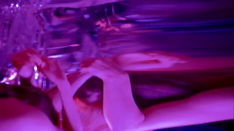 Emotional Dancer Performing among Distorted Mirror Reflections under Neon Light Stock Footage 306982327