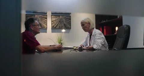 Emotional Elderly Man Gets a Bad Diagnosis From Doctor Stock Footage 99838206