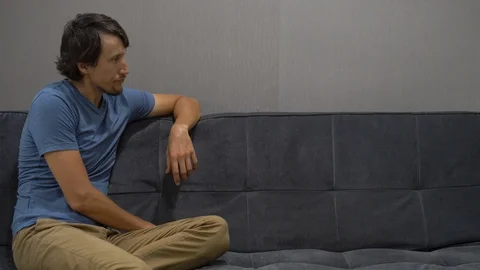 Emotional intelligence concept. A man disappointed by what is happening on the Stock Footage 102883905