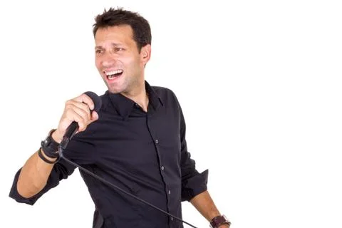 Emotional male singer with microphone Stock Photos