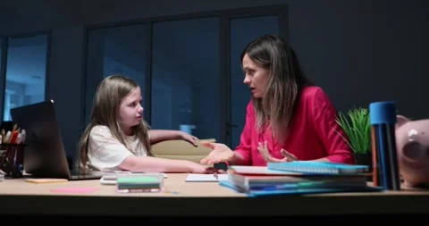 Emotional mother explains math problem to daughter student 库存影片 295664263