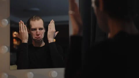 An Emotional Reflection in a Vanity Mirror Evoking Personal Introspection and Stock Footage 316053323