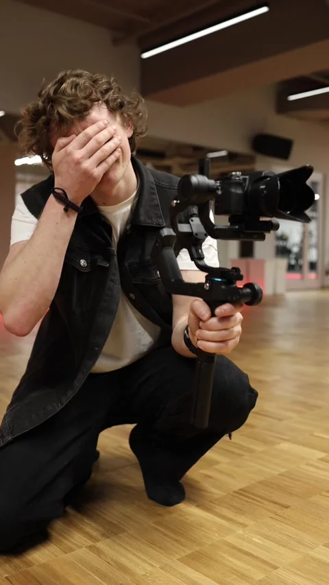 Emotional videographer almost crying Stock Footage 332116710