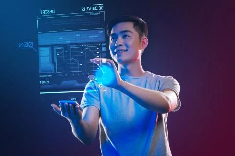 Emotional web developer feeling happy and making a holographic projection Stock Photos