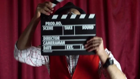 Emotions clown with clapperboard Stock-Footage 84673938