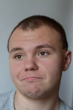 Emotions. The young man thinks of something Stock Photos