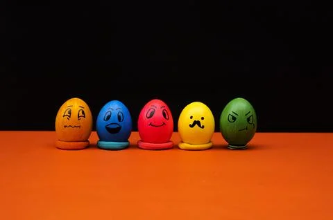 Emotive Painted Easter Eggs on Contrasting Background Stock Photos