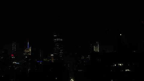 Empire State Building lighting up with fireworks on the 4th of July at night NYC Stock Footage 134425218