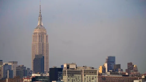 Empire State Building (medium-wide) static shot under gray sky Stock Footage 106479336
