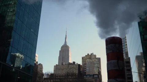 Empire State Building Set Against a Backdrop of Urban Skyscrapers 動画素材 291508997