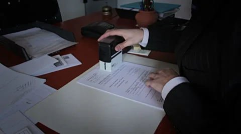 Employed, stamping documents for authentication Stock Footage 54877050