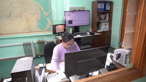 The employee analyzes the seismic activity data in the region Stock Footage 305697152