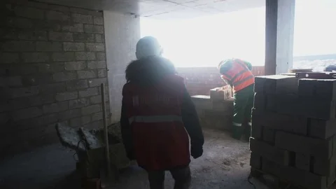 Employee approaches the builder Stock Footage 82069527