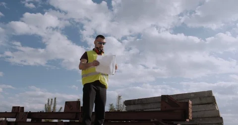 An employee, architect, checks the planning of the work done. Stock Footage 127121845