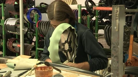 Employee assembling leather steering wheel Stock Footage 22413846