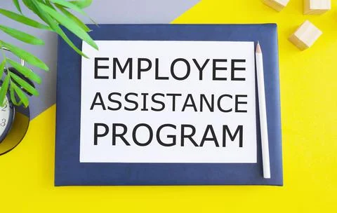 Employee Assistance Program business text written on white paper above Notebo Stock Photos